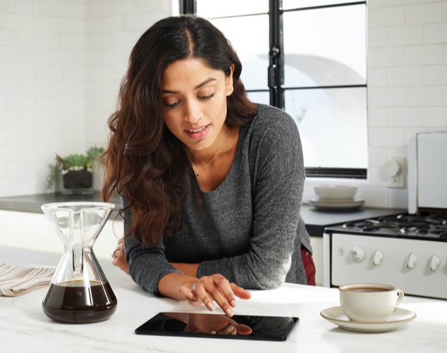 Person touching tablet device